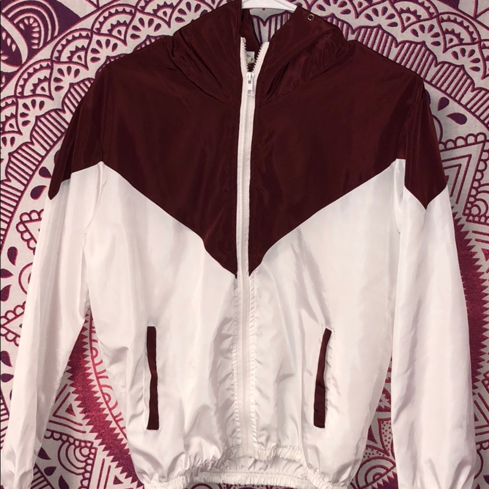 a burgundy and white windbreaker